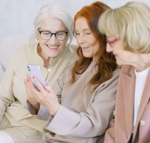 group of women videochatting via smartphone